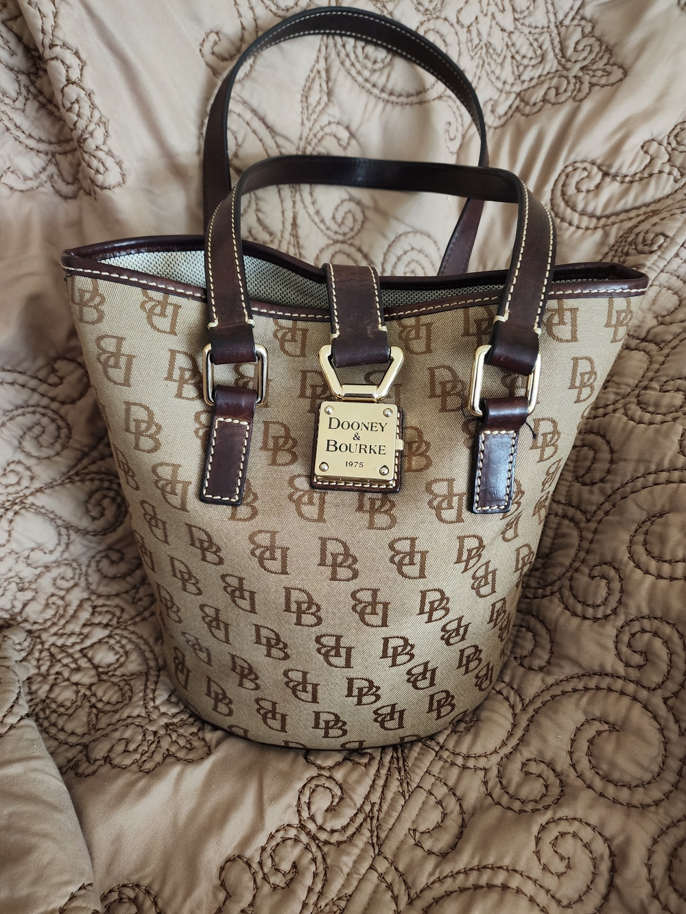 Dooney & Bourke Tan Logo Bucket Bag with Brown Trim